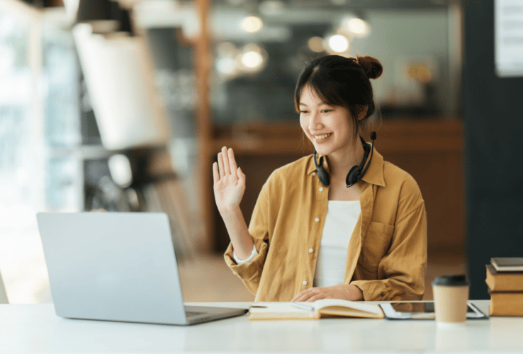 Female-waving-at-laptop_Blog--738x500-f50_50
