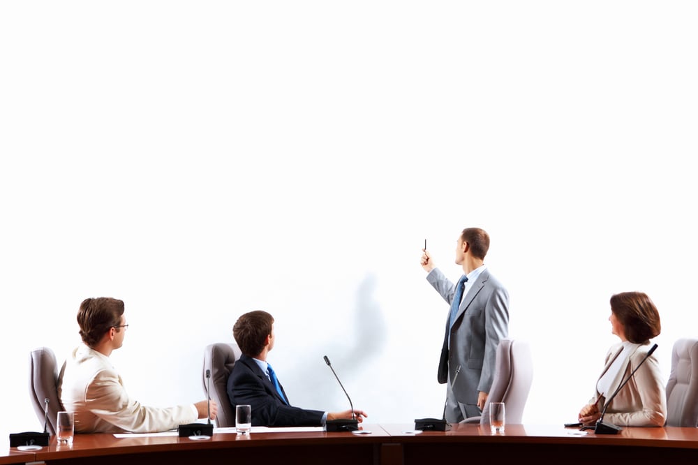 Image of businesspeople at presentation looking at screen. Space for advertisment-1 Image of businesspeople at presentation looking at screen. Space for advertisment-1