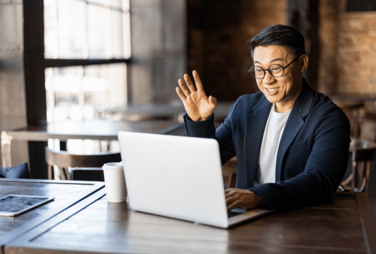 Male-waving-at-laptop_Blog--738x500-f50_50