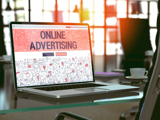 Online Advertising Concept. Closeup Landing Page on Laptop Screen in Doodle Design Style. On Background of Comfortable Working Place in Modern Office. Blurred, Toned Image. 3D Render.-1