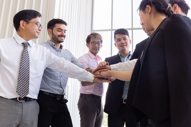 diverse-colleagues-stacking-hands-in-office-2025-01-29-05-57-18-utc-1